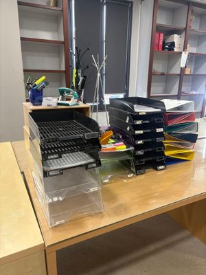 a desk with a lot of boxes on top of it