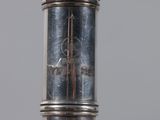 a close up of a silver object on a table