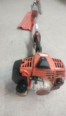 an image of a string trimmer on the floor