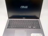 the asus laptop is open and ready to be used