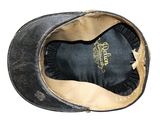 a black hat that has a gold emblem on it