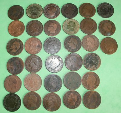 a lot of coins that are on a green surface