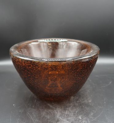 a brown bowl sitting on top of a table