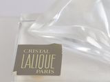 a clear glass vase with a label on it