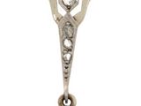 an image of a pair of earrings with a diamond in the center