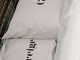 two bags of pillows sitting on top of each other