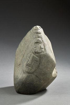 an image of a rock with a carving of a man on it