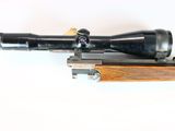 an old rifle with a scope on a white background