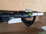 a black and white flashlight that is in a box