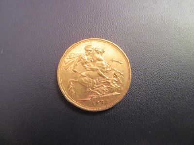 a gold coin with a picture of a man riding a horse on it