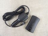 a black charger and a cord on a table