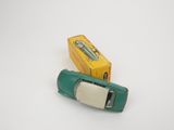 an image of a green toy car next to a yellow box