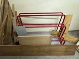 several pieces of wood are stacked on top of each other in a room