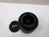 a camera lens sitting on top of a white table