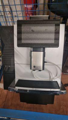 a coffee machine that is sitting on a table