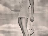 an old black and white photo of a woman in a bathing suit