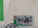 a picture of a green and white envelope with a stamp on it
