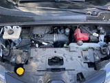 the engine of a car with its hood open and the hood up