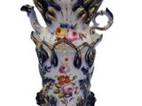 a vase that has flowers on it on a white background