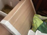 a white toilet sitting in the middle of a cluttered room