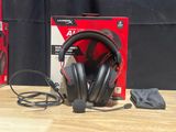 a pair of headphones sitting on a table next to a box