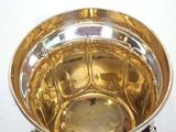 a silver bowl that is sitting on a table