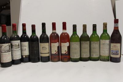 many bottles of wine lined up on a table