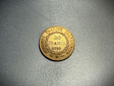 a close up of a gold coin on a table