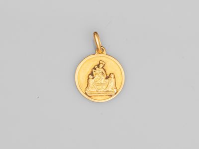 une pièce d'or sur laquelle figure l'image de la Vierge à l'Enfant