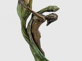 a statue of a woman holding a flower in her hand