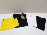 three t - shirts are sitting on a white table next to each other