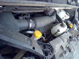 a close up of a car ' s engine with a yellow cap