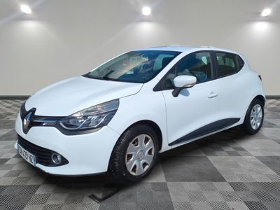 a white car is parked in a room with a checkered floor