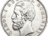 Gros plan sur une pièce de monnaie portant le visage d'un homme