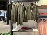 a display of clothes and shoes in a clothing store