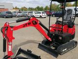 une mini-pelle rouge garée sur un parking