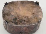 an old wooden box sitting on top of a white surface