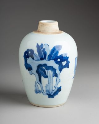a blue and white vase with a horse on it