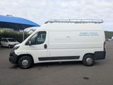 a white van that is parked in a parking lot