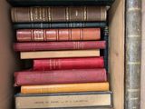 many books in a box that are stacked together