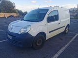 a white van that is parked in a parking lot