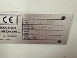 a label on the back of a machine that is sitting on a table