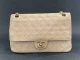 a chanel beige quilted leather shoulder bag