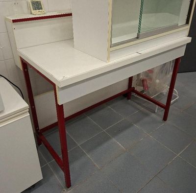 a white desk with a mirror on it in a bathroom