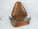 a brown metal container with a clock on top of it