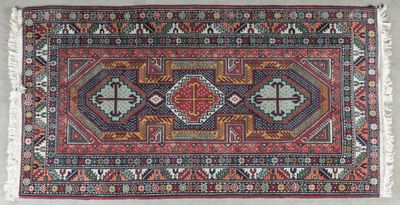an old persian rug with geometric design and fringe fringes