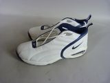 pair of white and blue nike air max sneakers on a white surface