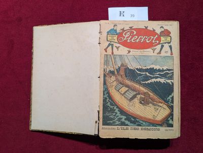 un vieux livre sur lequel figure l'image d'un bateau