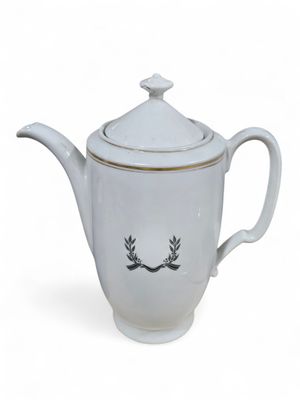 white teapot with a lid with a laurel design on it
