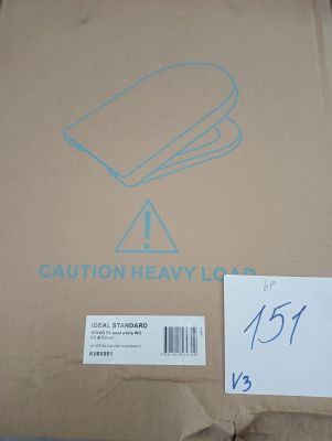 a cardboard box with a sign on it that says caution heavy load